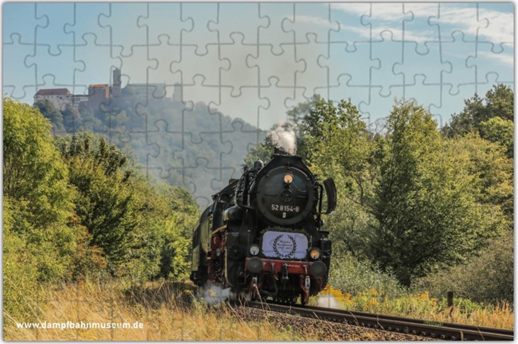 Das Bild zeigt die Puzzle Vorlage Museumszug am Wartburgblick. Die Vorlage zeigt den Zug vor dem Hintergrund der Wartburg.